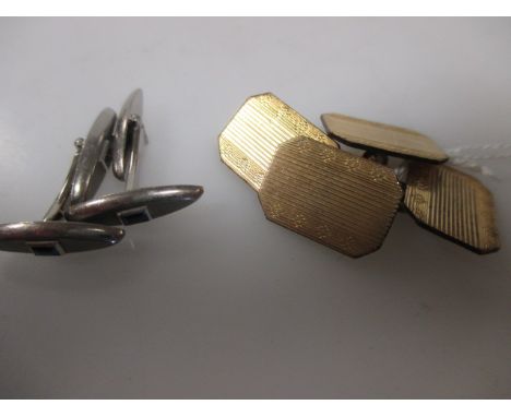 A pair of unmarked white precious metal and synthetic sapphire navette shaped cufflinks together with a pair of unmarked yell