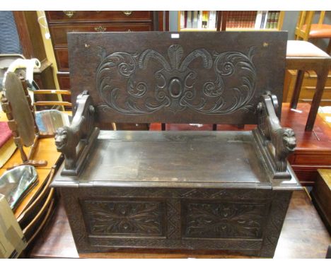 A Jacobean revival carved oak monks bench  