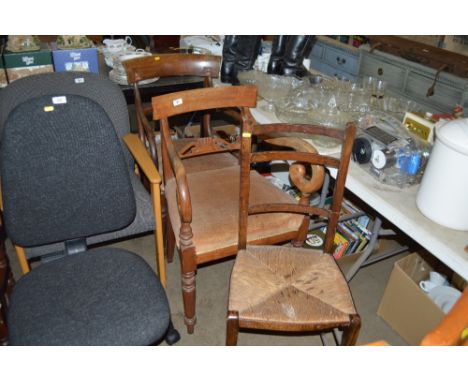 Two Victorian mahogany elbow chairs together with a ladder back chair