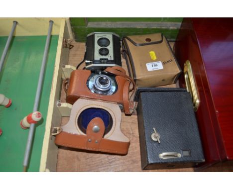 A box camera together with three others 