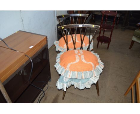 A pair of Ercol style stick back dining chairs