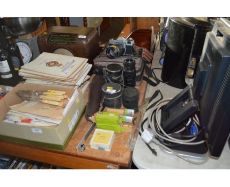A Praktica camera in carrying case; various lenses etc