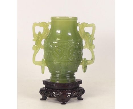 A Jade Vase with Hoop Handles on Hardwood Style Stand. Height: 15.5cm
