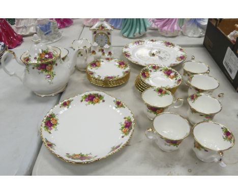 A Collection of Royal Albert Old Country Roses to include Wall Clock, Mantle Clock, Cruet Items, Six Trios, Teapot, Milk Jug 