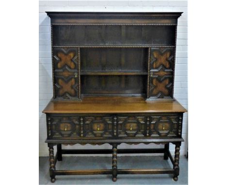 Oak Jacobean style dresser, with shelved plate back and  cupboards over two long drawers to the frieze, with bobbin legs 183 