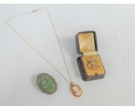 Seed pearl star burst brooch stamped 9ct, cameo necklace on 9 carat gold chain and a Chinese silver and carved jadeite brooch