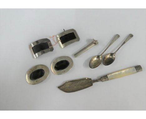 Mixed lot to include a Georgian silver and mother of pearl handled butter knife, silver buckles and silver teaspoons etc (a l