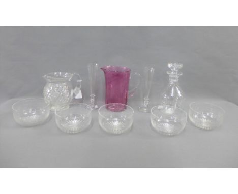 Collection of glass wares to include a cranberry glass jug, a decanter and stopper, a cut glass water jug, five finger bowls 