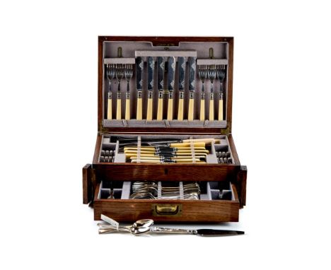 AN EARLY 20th CENTURY OAK CANTEEN CASE containing sundry EPNS CUTLERY, a set of six plated GRAPEFRUIT SPOONS, and a silver-ha