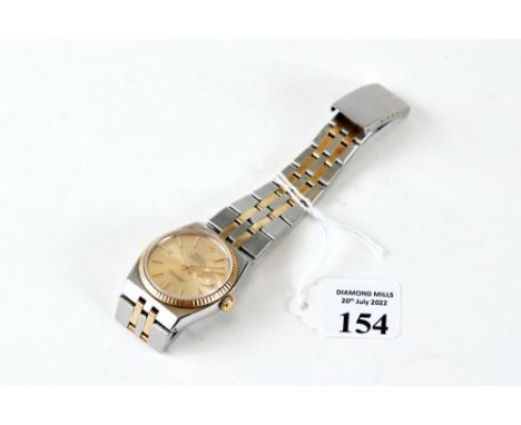 A GENTS 1980S ROLEX STAINLESS STEEL AND YELLOW METAL OYSTER QUARTZ DATEJUST WRIST WATCH, model 17013, with champagne dial wit