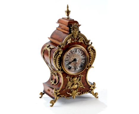 LENZKIRCH, GERMANY, A LATE 19th CENTURY ROCOCO INFLUENCE MANTEL CLOCK, silvered dial with twin train movement, the walnut cas