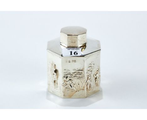 A GEORGE V OCTAGONAL SILVER TEA CADDY AND COVER with embossed figure and landscape decoration, maker: RN.RH, Chester 1911, ap