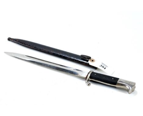 A GERMAN BAYONET with nickel plated hilt and textured grips, hooked quillon, 10" fullered blade with black painted steel scab