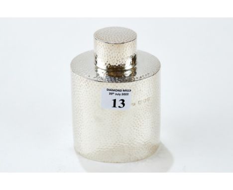 A LATE VICTORIAN OVAL SPOT-HAMMERED SILVER TEA CADDY with slip on cover, maker: AC, London 1894, approx 5 oz. £75-£90