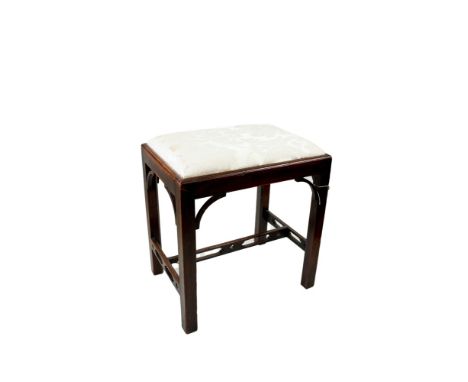 AN EDWARDIAN MAHOGANY CHIPPENDALE REVIVAL DRESSING STOOL, upholstered seat on square chamfered legs with corner brackets and 
