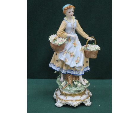 DRESDEN HAND PAINTED AND GILDED CERAMIC FIGURINE OF A LADY WITH BASKETS, APPROXIMATELY 33cm HIGH