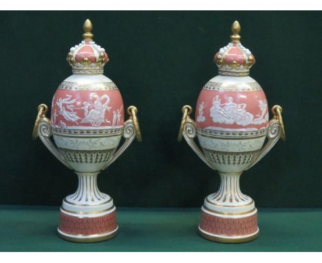 PAIR OF GILDED AND RELIEF DECORATED MEISSEN STYLE CERAMIC URNS WITH COVERS, APPROXIMATELY 39cm HIGH 