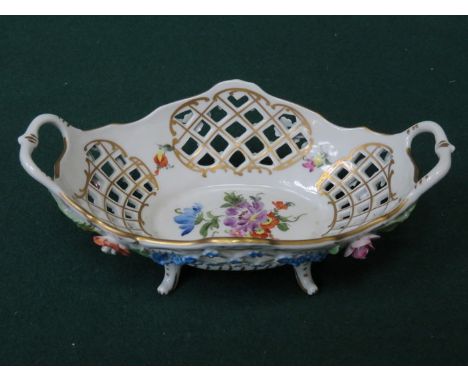 DRESDEN HANDPAINTED AND GILDED PIERCEWORK DECORATED TWO HANDLED BASKET ON RAISED SUPPORTS