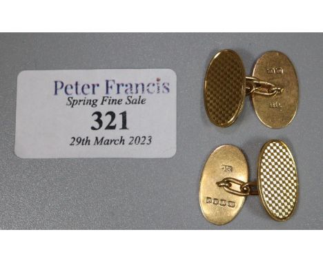 A Pair of 18ct gold oval chain link cufflinks with engine turned decoration to both sides.  Approx weight 8.6 grams.(B.P. 21%