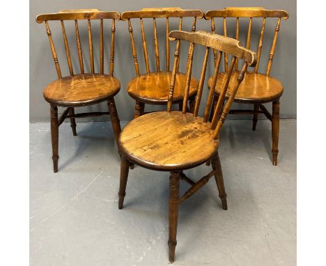 Set of four early 20th century beech stained Windsor penny kitchen chairs, having circular moulded seat on ring turned legs. 