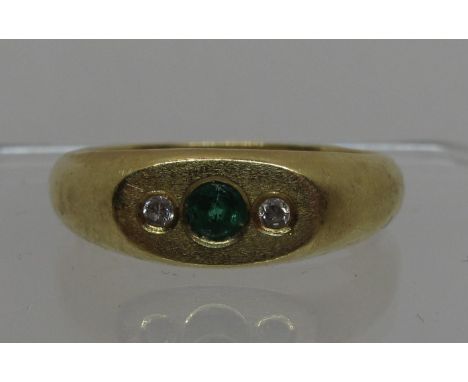 Diamond and green stone ring set in 18ct gold. Ring size R.  Approx weight 5.9 grams.(B.P. 21% + VAT) 