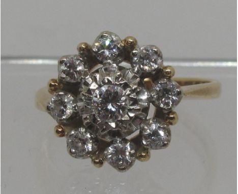 Diamond cluster ring set in 18ct gold.  The brilliant cut diamonds set in an open cluster.  Estimated total diamond weight 0.