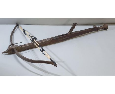 George III English stone crossbow having mahogany stock, steel bow with hinged fork foresight, and steel button pommel. Overa