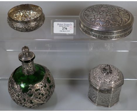 Collection of Indian white metal dressing table items, to include: circular box and cover decorated with exotic birds and ani