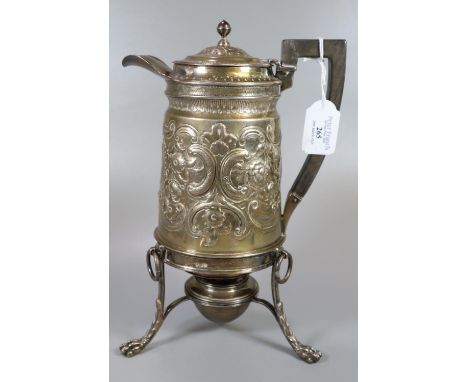Georgian silver spirit kettle on stand, the kettle having repoussé floral and foliate decoration with an ebonised handle, the