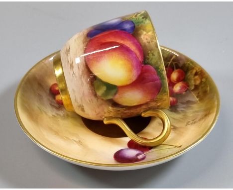 Royal Worcester porcelain demi-tasse hand painted with fruit with a gilt interior, signed E Townsend and Moseley. (B.P. 21% +