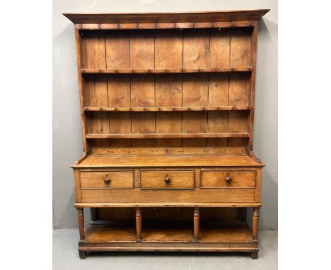 19th century Welsh oak two stage pot board dresser, the moulded cornice above rack back with three fitted shelves and iron ho