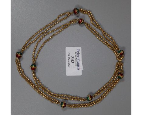 Indian gold necklace decorated with red and green enamel gold beads.  Length 31 inches (79cm). Approx weight 34.4 grams.(B.P.