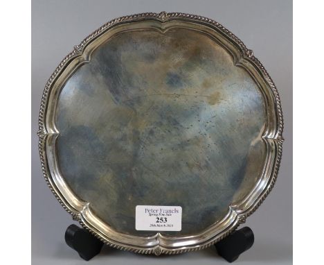 Late Victorian silver pie crust salver with gadrooned edge standing on four shell feet by 'Harrison Bros. and Howson' Sheffie