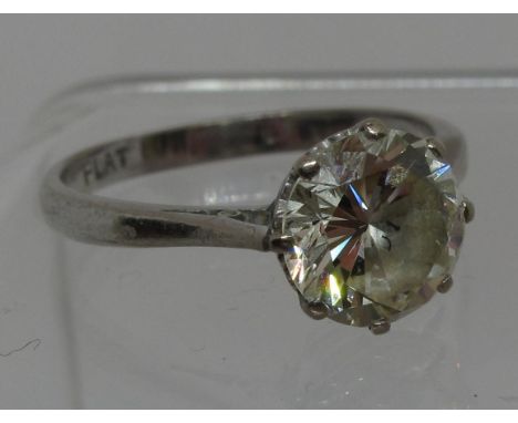 A 2ct diamond solitaire ring set in platinum. The old brilliant cut diamond an estimated diamond weight of 2.03cts. Ring size