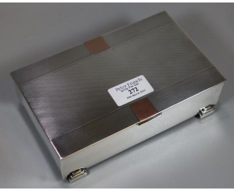 Silver Art Deco cigar box, the hinged and engine turned top above four geometric stepped feet, Birmingham hallmarks. 17x10.5x