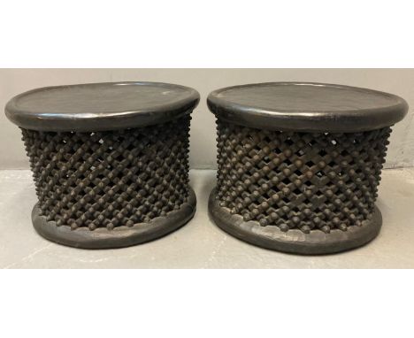 Pair of African hardwood Bamileke drum shaped lattice design side/lamp tables.  65cm diameter approx.  45cm high approx.   (2