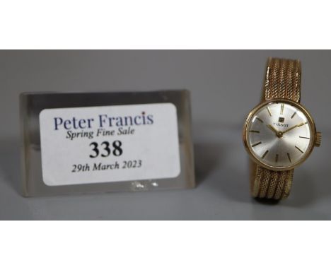 Tissot 9ct gold ladies bracelet dress watch with satin face having baton numerals and gold mesh bracelet strap.  Overall 17g 