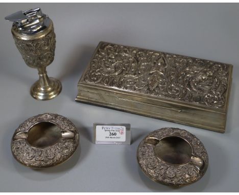 Collection of Thai silver items, to include: cigar box, pair of ash trays and a table lighter marked 'Sterling Thailand' to t