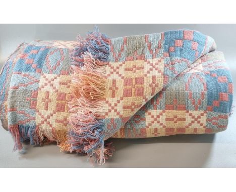 Vintage pink, blue, cream and yellow woollen Welsh tapestry blanket with fringed edge and geometric design. 222 x 225cm appro