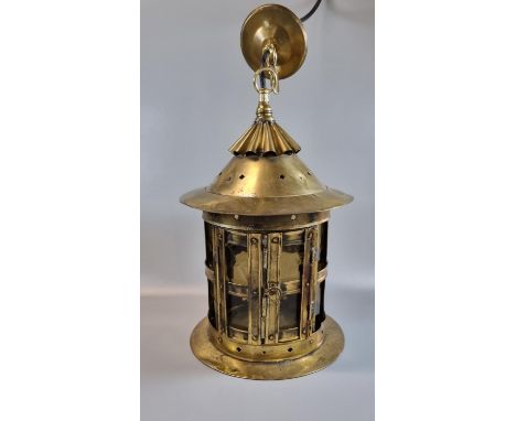 Arts and Crafts design brass hall lantern, the fluted gallery above circular brass and glass panels, appearing to have been c