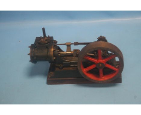 A STUART TURNER STYLE HORIZONTAL MILL ENGINE, with red painted 5" fly wheel mounted on a hardwood base
