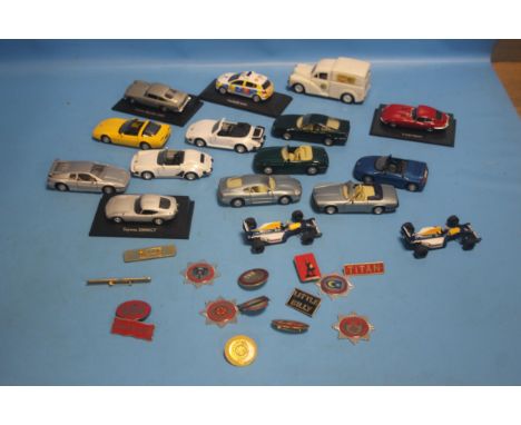 SIXTEEN UNBOXED CARS to include saloon cars, sports cars, Formula One cars, Morris Minor van, police car etc. by Maisto, Saic