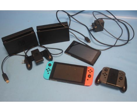 A NINTENDO SWITCH CONSOLE, together with a collection of accessories, parts not checked