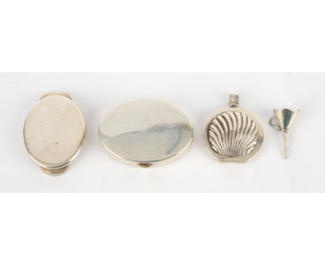 A Tiffany sterling silver folding compact of oval hinged form, width 5.5cm, a Tiffany sterling silver folding miniature vanit