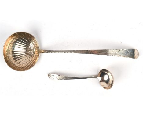 George III Irish shell bowl silver ladle with bright cut decoration and Boars Head crest, by John Power, Dublin 1792 and a sa