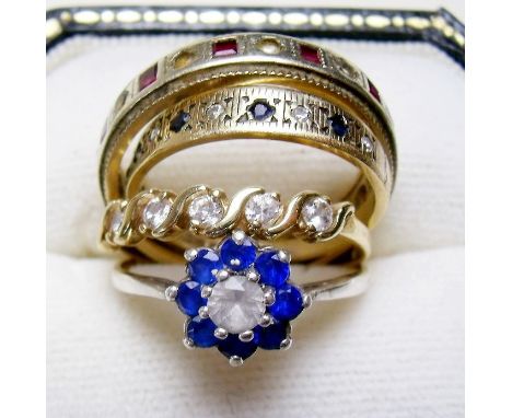 A 9 carat gold eternity ring, two other 9 carat gold rings and a silver and gold ring