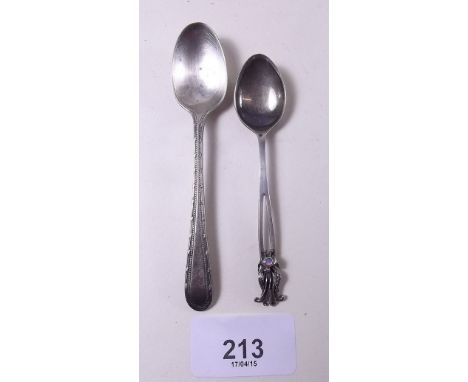 A silver spoon decorated exotic bird and set opal and another silver spoon