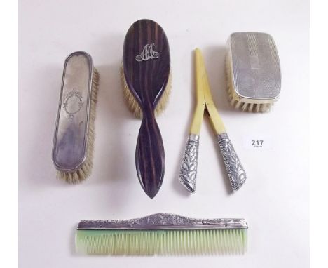 Two silver backed brushes, a pair of silver glove stretchers and a comb