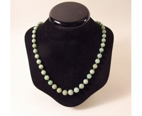 A string of graduated 'Jade' beads