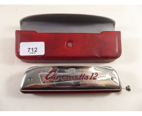 A cased 'Chrometta 12' harmonica by Houner